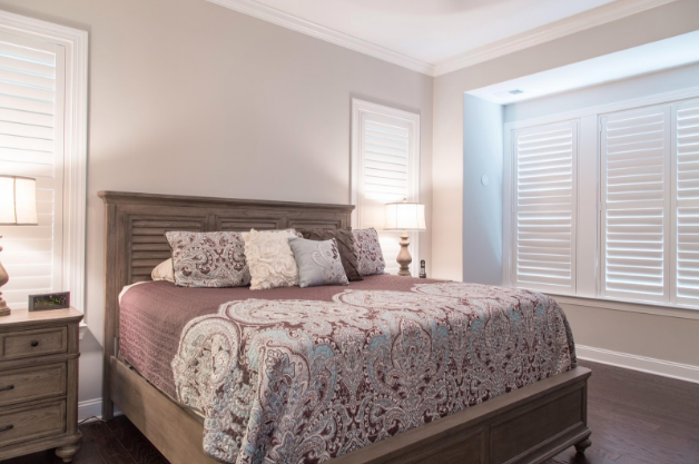 Southern California bedroom with light block shutters